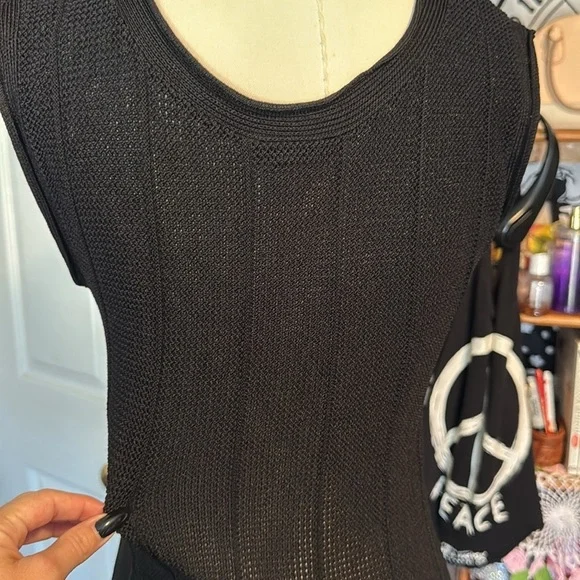 Caelian black open knit dress floral appliqué along lower hemline rounded neck